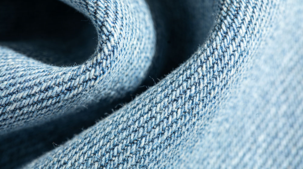 Durable denim fabric close-up, ideal for jeans, jackets and structured apparel production