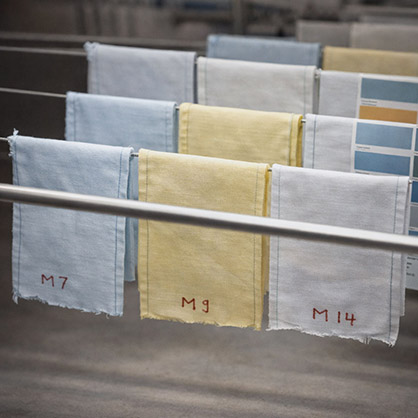 Color consistency control for lab dip to bulk alignment in fabric production capability